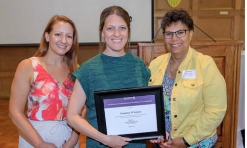 Erin, Courtney, and Lisa; Courtney is holding a certificate