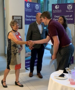 Mrs. Gail Bass presenting the Dr. Martin J. Bass Award in Family Medicine to Dr. Craig Olmstead (MClSc).